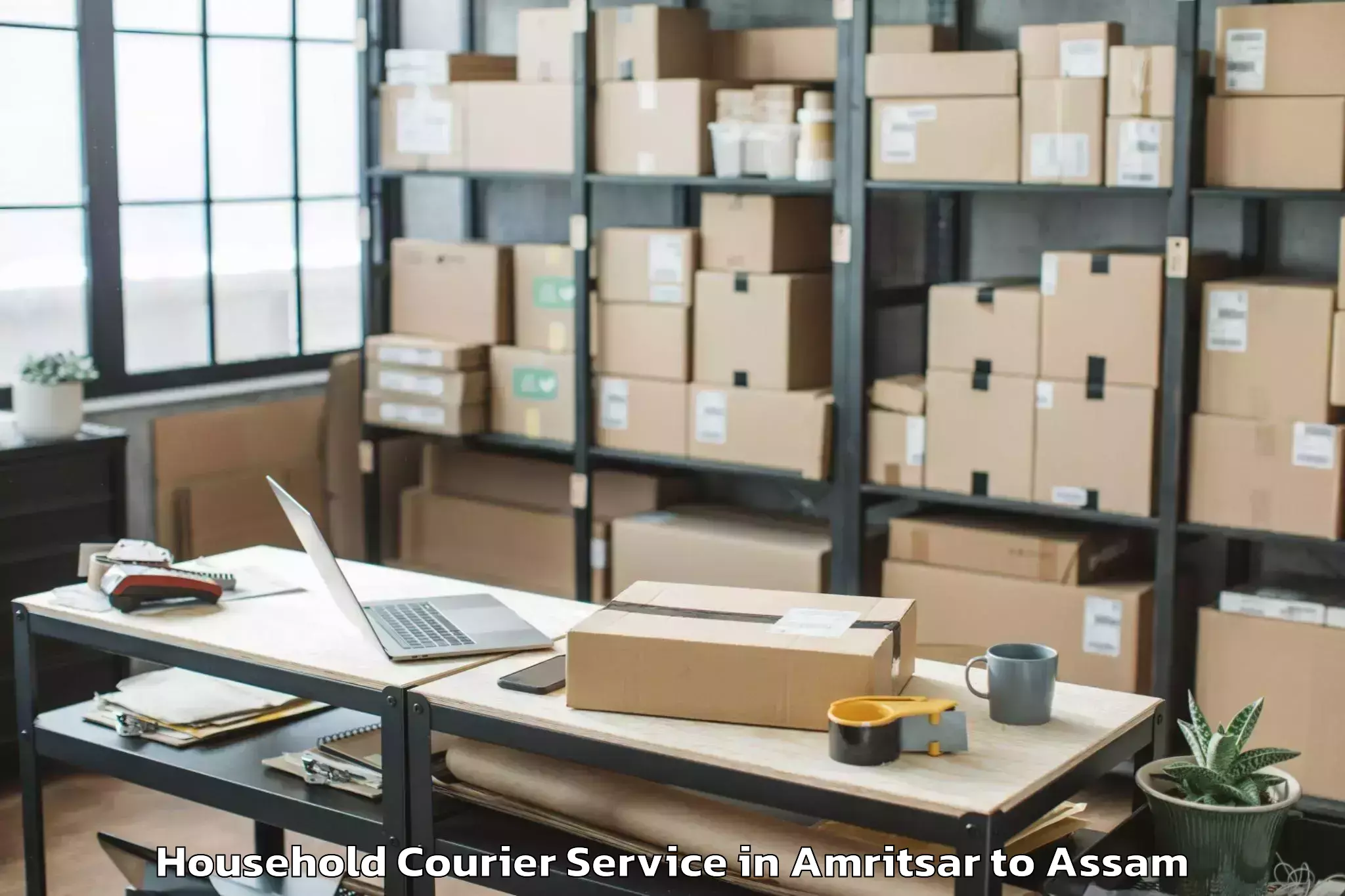 Top Amritsar to Rajapara Khatajuli Household Courier Available